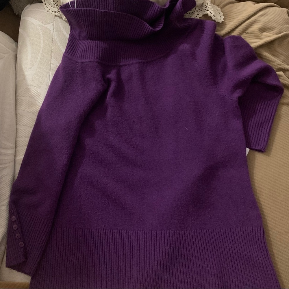 A purple turtleneck sweater